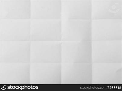 white textured sheet of paper folded in sixteen
