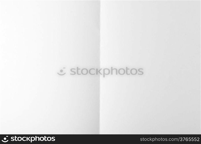 white textured sheet of paper folded in two
