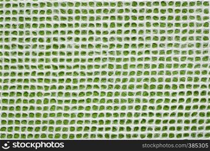 white Thai mulberry lace paper with a grid pattern against green background