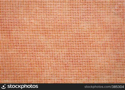 white Thai mulberry lace paper with a grid pattern against orange background