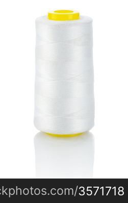 white thread on yellow spool