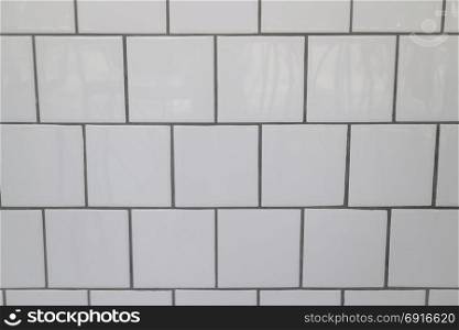 White tiles wall in modern kitchen, stock photo