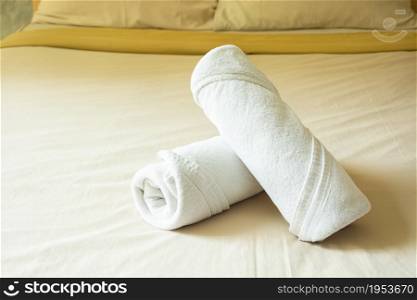 White Towel Roll Cream Rolls On Yellow Cotton Mattresses.