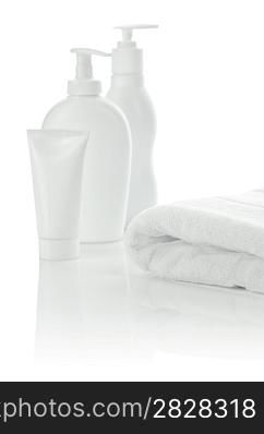 white towel with bottles and tube