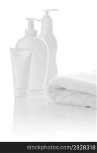 white towel with bottles and tube