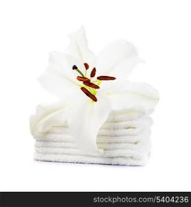 White towels with lily flower isolated on white