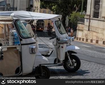 White Tuk-Tuk Urban Vehicles for Tourists Transportation in Lisbon, Portugal. White Tuk-Tuk Urban Vehicles for Tourists Transportation in Lisb
