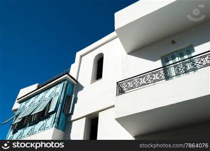White Tunisian Home with Blue Shutters