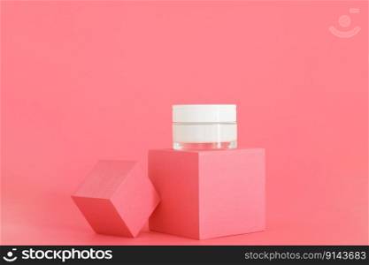 White unbranded cosmetic cream jar standing on pink podium. Skin care product presentation on the pink background. Trendy mockup. Skincare, beauty and spa. White unbranded cosmetic cream jar standing on pink podium. Skin care product presentation on the pink background. Trendy mockup. Skincare, beauty and spa.