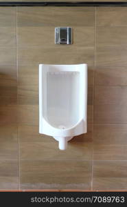 White urinals in the men&rsquo;s bathroom of interior decoration for design in your work concept.