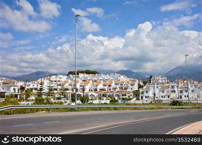 White village of Punta Lara next to the Calle Goya street on Costa del Sol, near resort town of Nerja in southern Andalucia, Malaga province, Spain.