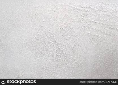 White wall with a powdery substance. Can be used as a background for your projects