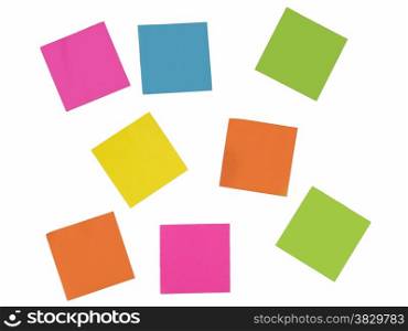 white wall with papers in green yellow blue pink and orange