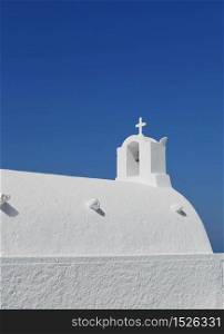 White washed traditional Greek church against blue sky background. White washed Greek church