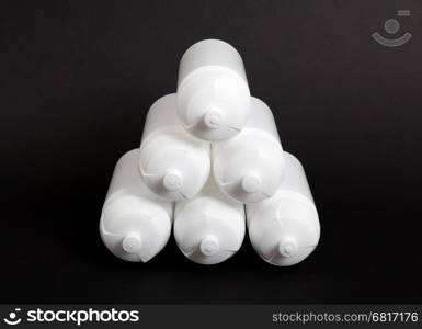 White water bottles isolated on black background