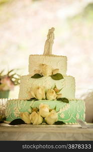 white wedding cake with roses