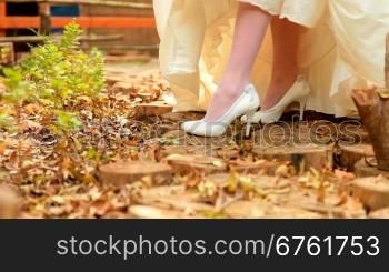 white wedding shoes in the autumn park