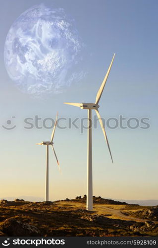 white wind turbine in the top of the mountain