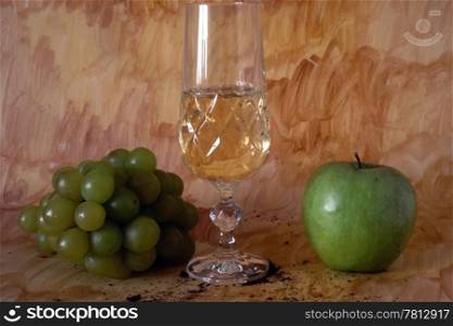 White wine and fruits isolated on painted background