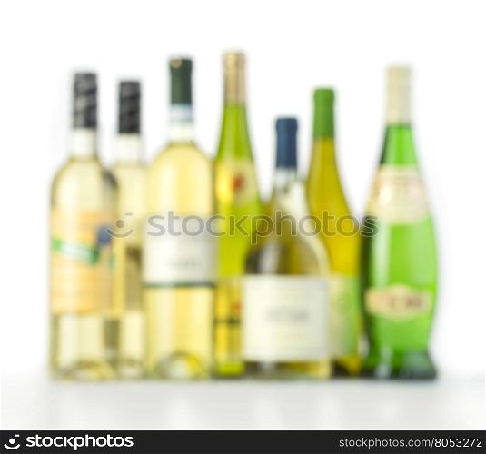 White wine bottles on white background with blur effect