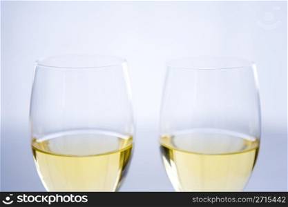 White wine poured in two wine glasses