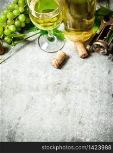 White wine with corks. On the stone table.. White fresh wine.
