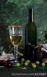 White wine with fruits on painted background