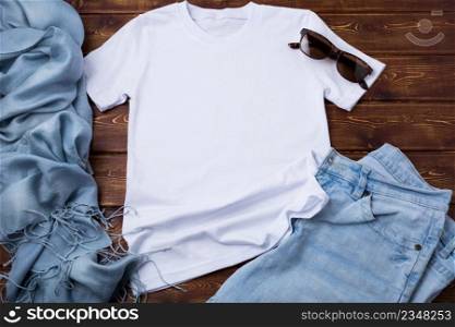 White women cotton T-shirt mockup with blue jeans, sunglasses and turquoise scarf. Design t shirt template, tee print presentation mock up