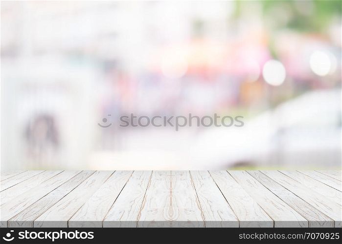 white wood table top on blurred background from shopping mall, Space for montage your product