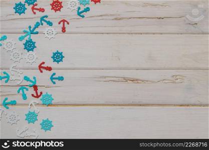 white wooden surface with colored summer items