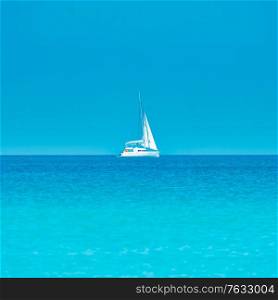 White yacht on blue sea with blue water and sky