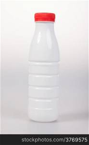 White Yogurt Plastic Bottle with red cap on a white background