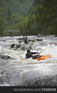 Whitewater Kayaker in Rapids