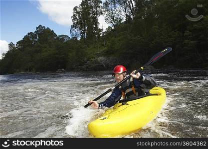 Whitewater Kayaker in Rapids