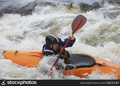 Whitewater Kayaker in Rapids