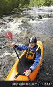 Whitewater Kayaker on River