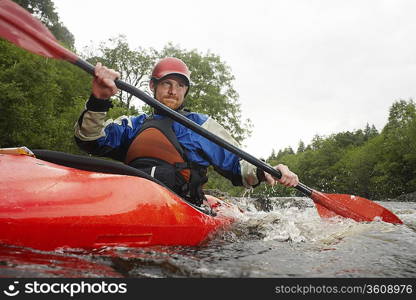 Whitewater Kayaker on River