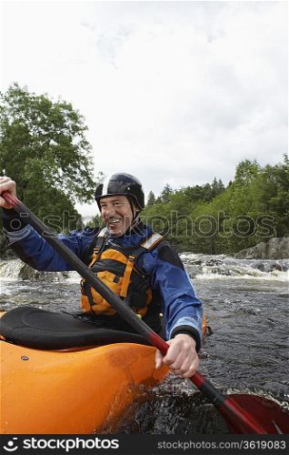 Whitewater Kayaker on River