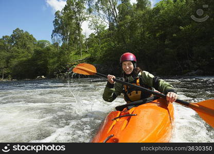 Whitewater Kayaker on River