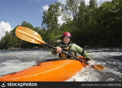 Whitewater Kayaker on River