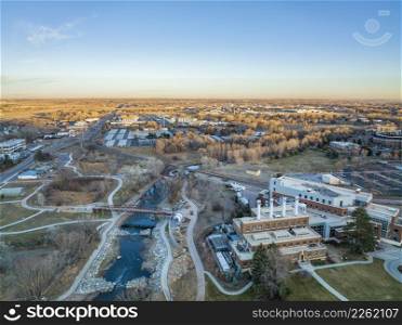 whitewater park on the Poudre River in downtown of Fort Collins, Colorado, aerial view in fall scenery at sunset with a low water