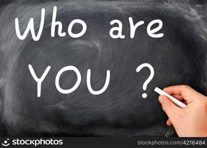 Who are you question written with chalk on a blackboard