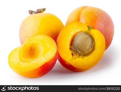 Whole and cut apricots with leaves isolated on white background. Whole and cut apricots with leaves