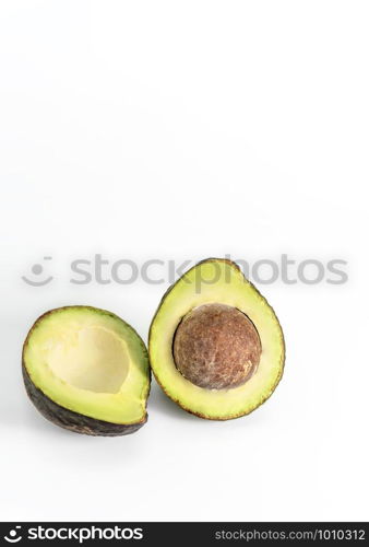 Whole and cut in half avocado fruit on white background. avocado fruit on white