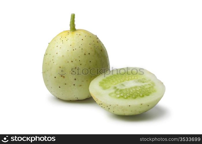 Whole and half Apple cucumber on white background