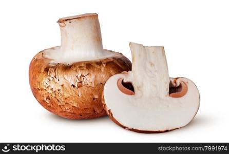 Whole and half brown champignons isolated on white background