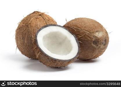Whole and half coconut isolated on white background