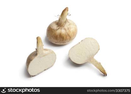 Whole and half Jicama roots isolated on white background