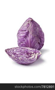 Whole and half Purple pointed cabbage on white background