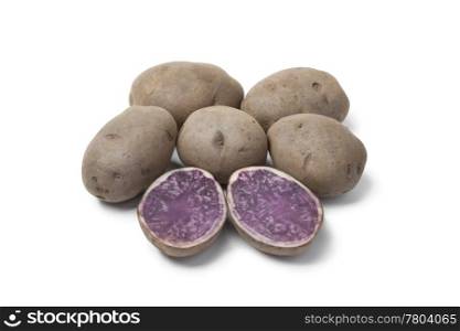Whole and half Truffle potatoes on white background